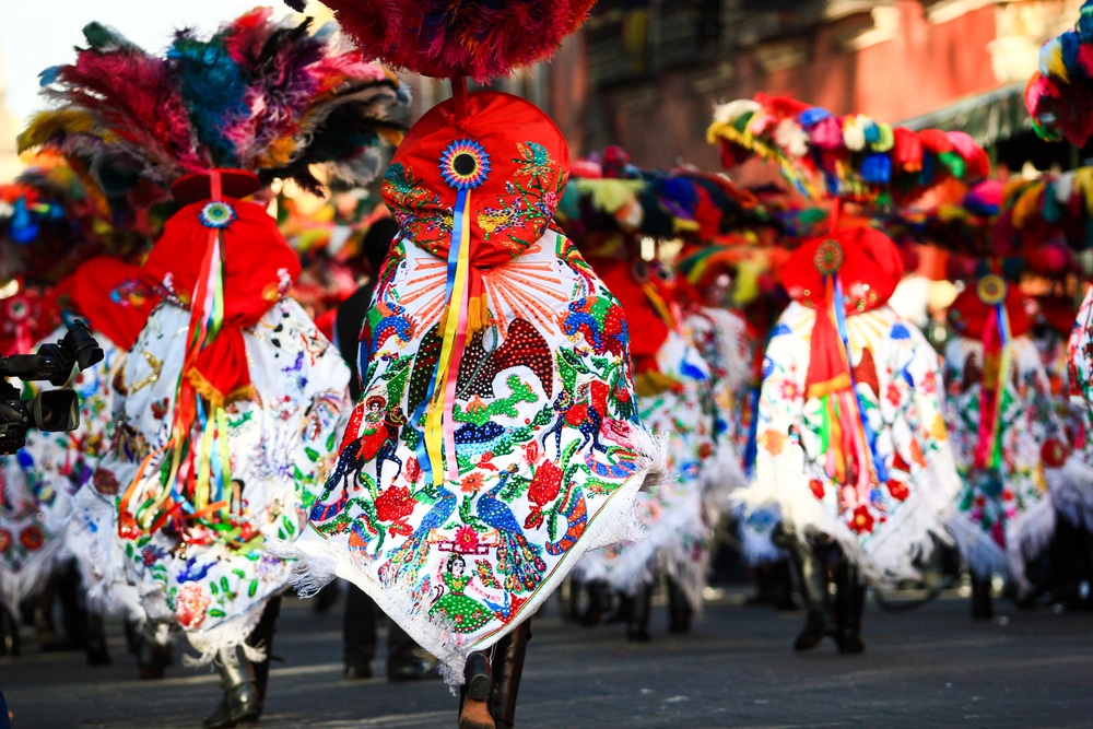 A view of people wearing colorful mexican attire at a carnival