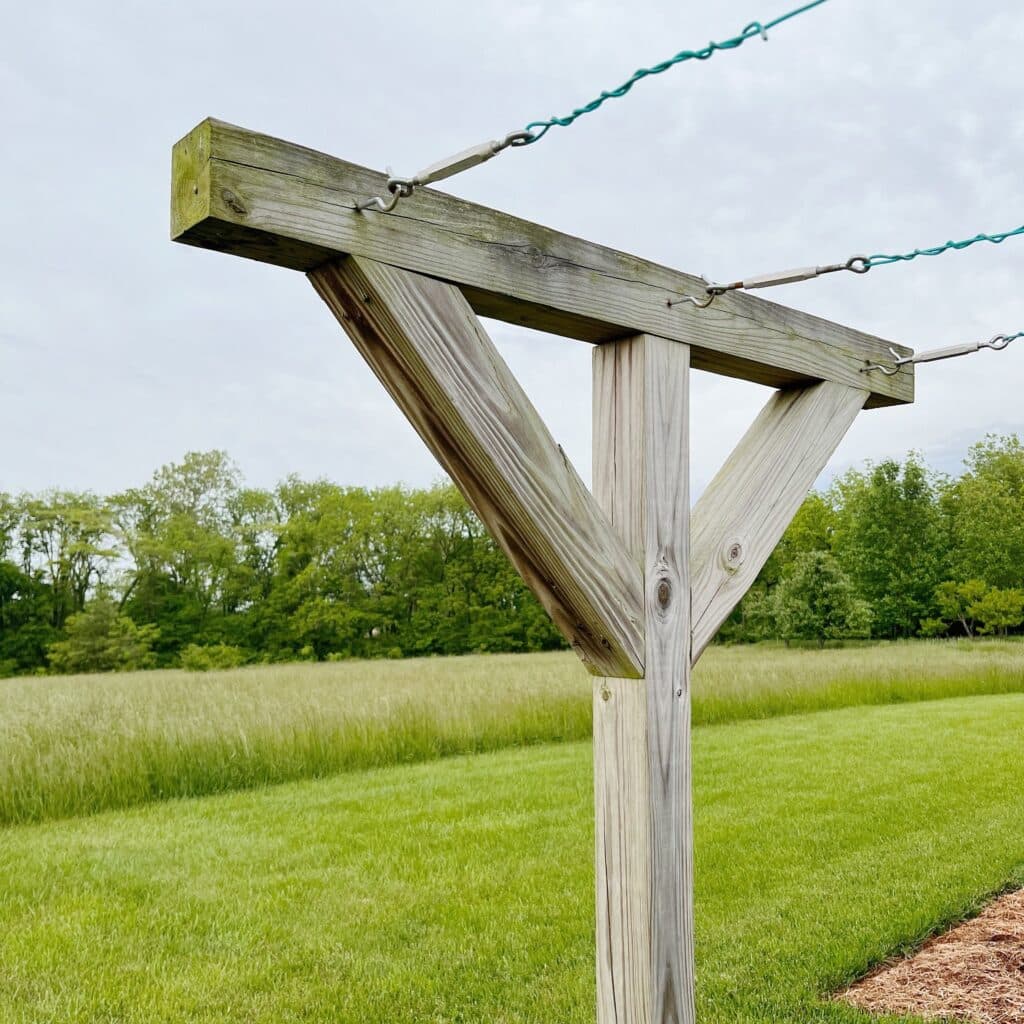 A wooden T post clothesline in a farm