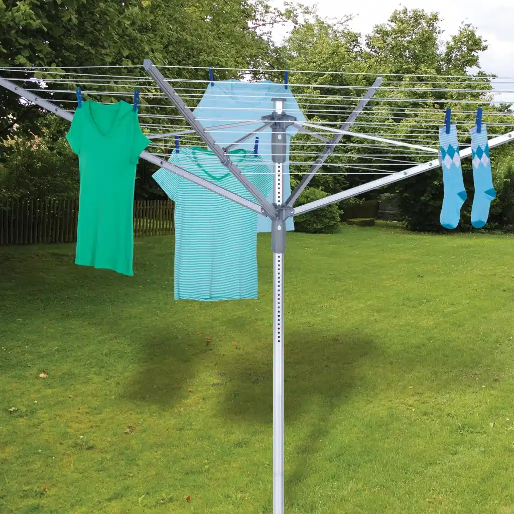 An outdoor umbrella drying rack hanging clothes