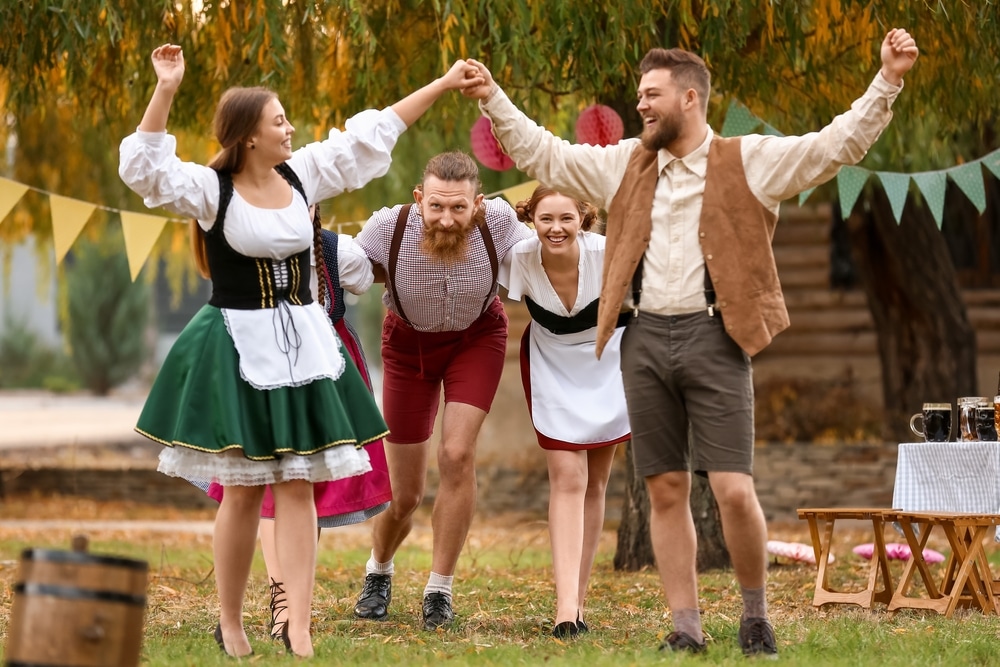 Drunk People Dancing And Celebrating Octoberfest Outdoors