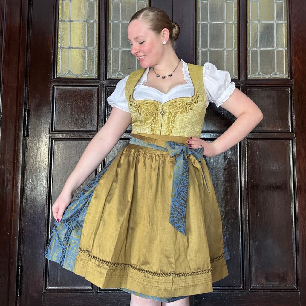 girl wearing golden yellow dirndl