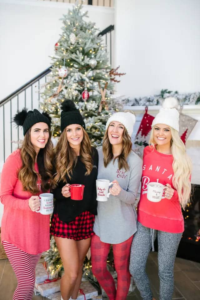 girls in pajamas enjoying a party holding cups