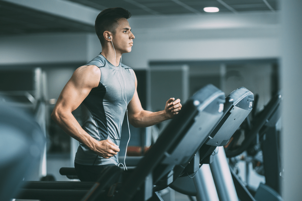 A view of a guy on a tread mill working out