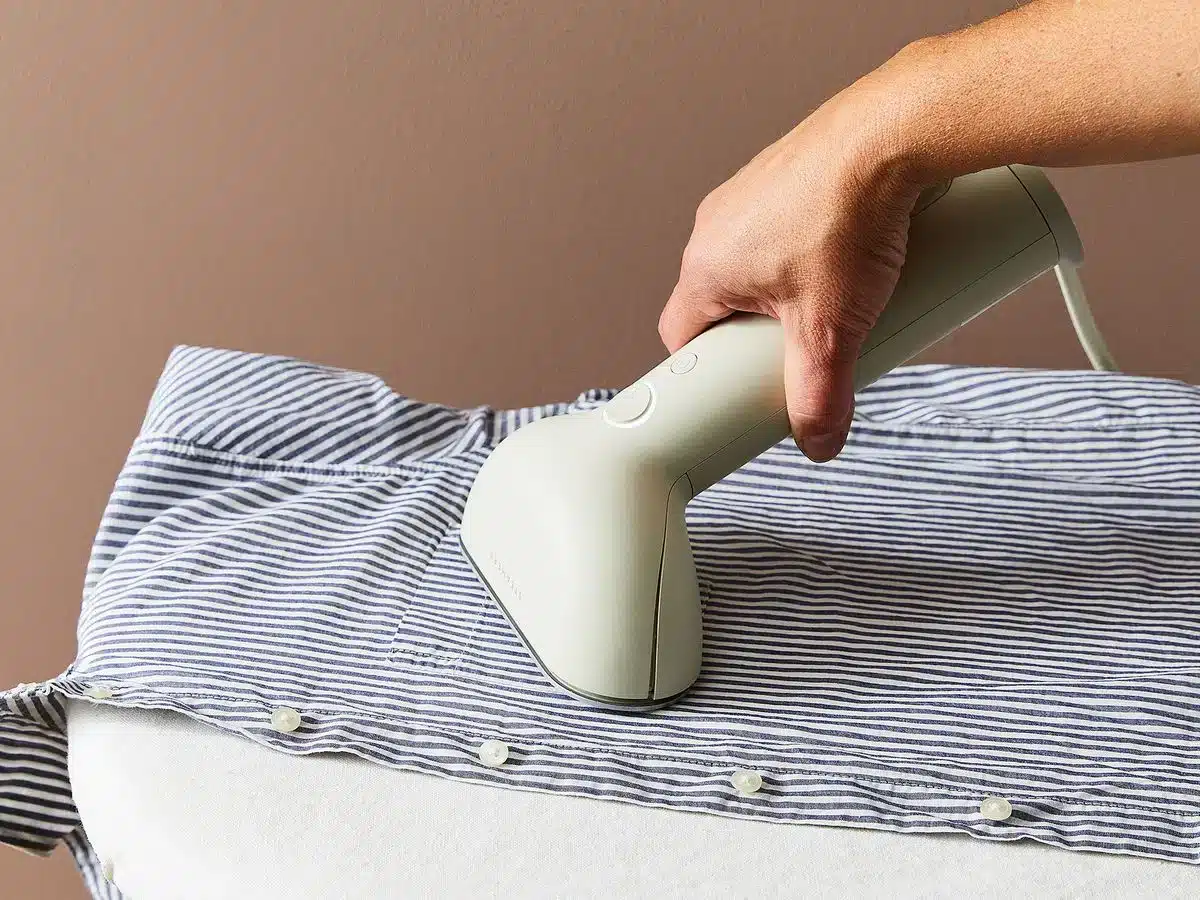 a person steaming the shirt