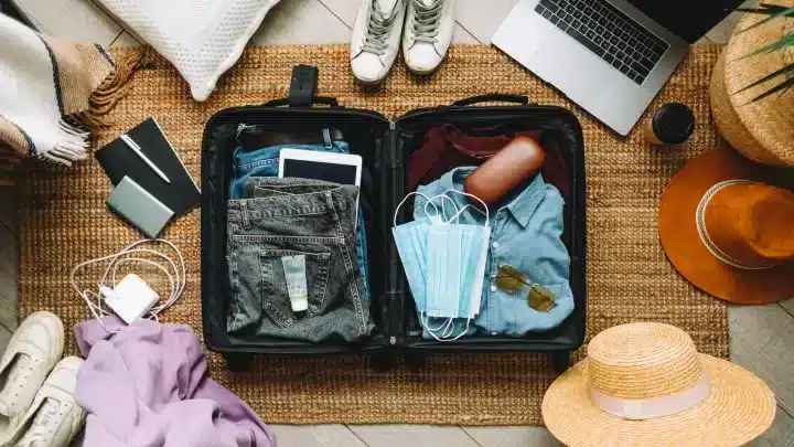 travel suitcase along with travel essentials