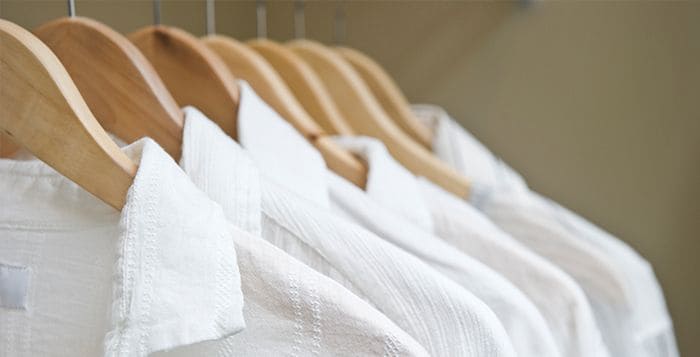 white shirts hanging with hangers