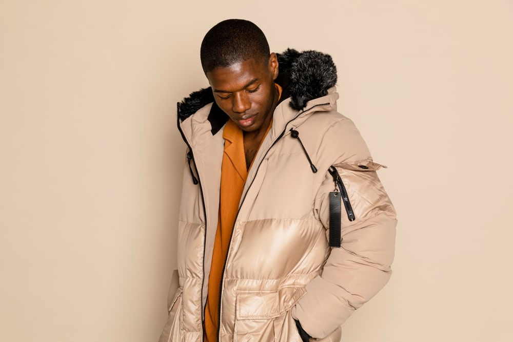 African American man wearing a winter jacket.