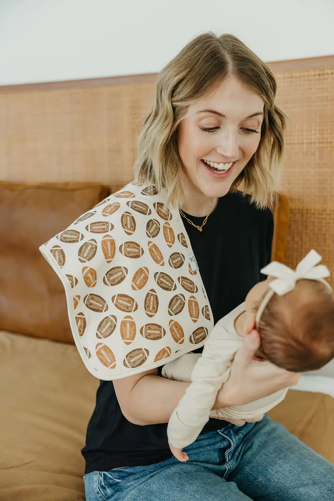 Copper Pearl Premium Burp Cloth on mother shoulder