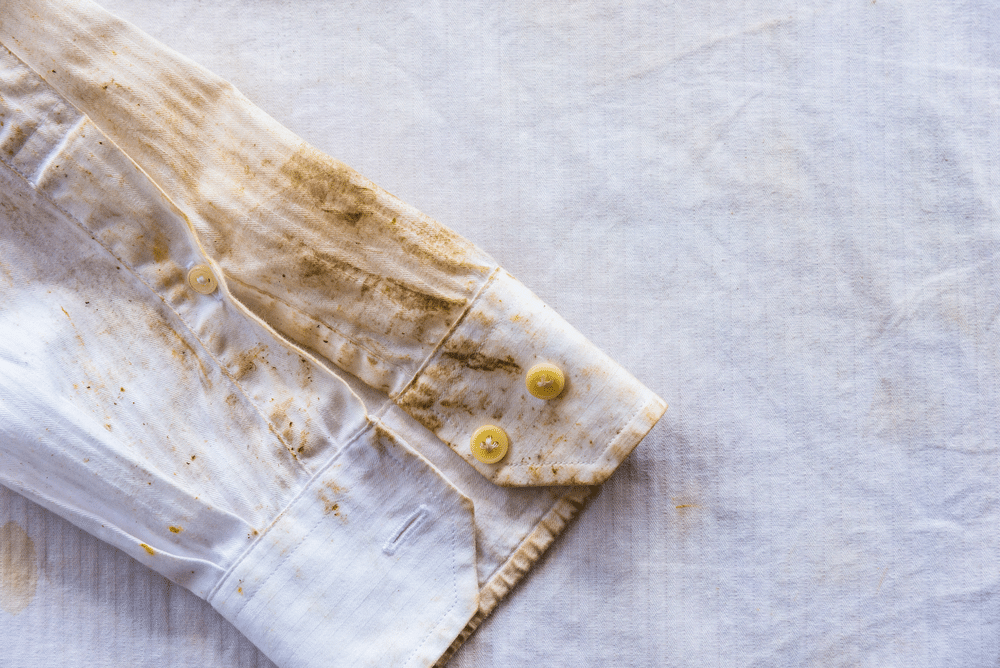 a shirt with mud stains