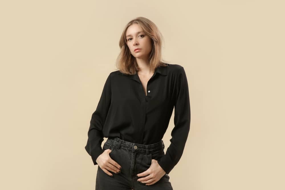 A view of a woman wearing a black button down